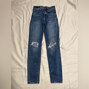 knee ripped denim jeans